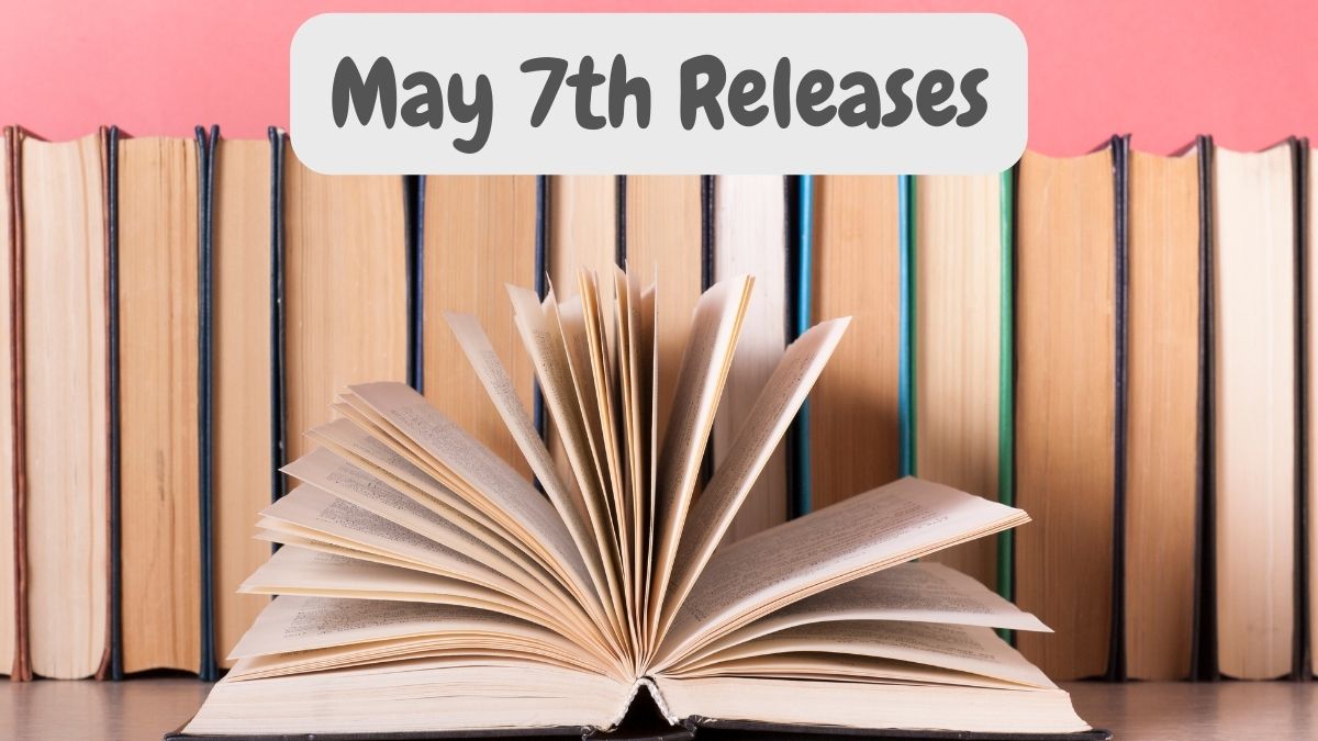 Photo of several books lined up against a pink wall, with one open book in front and the words May 7th Releases at the top