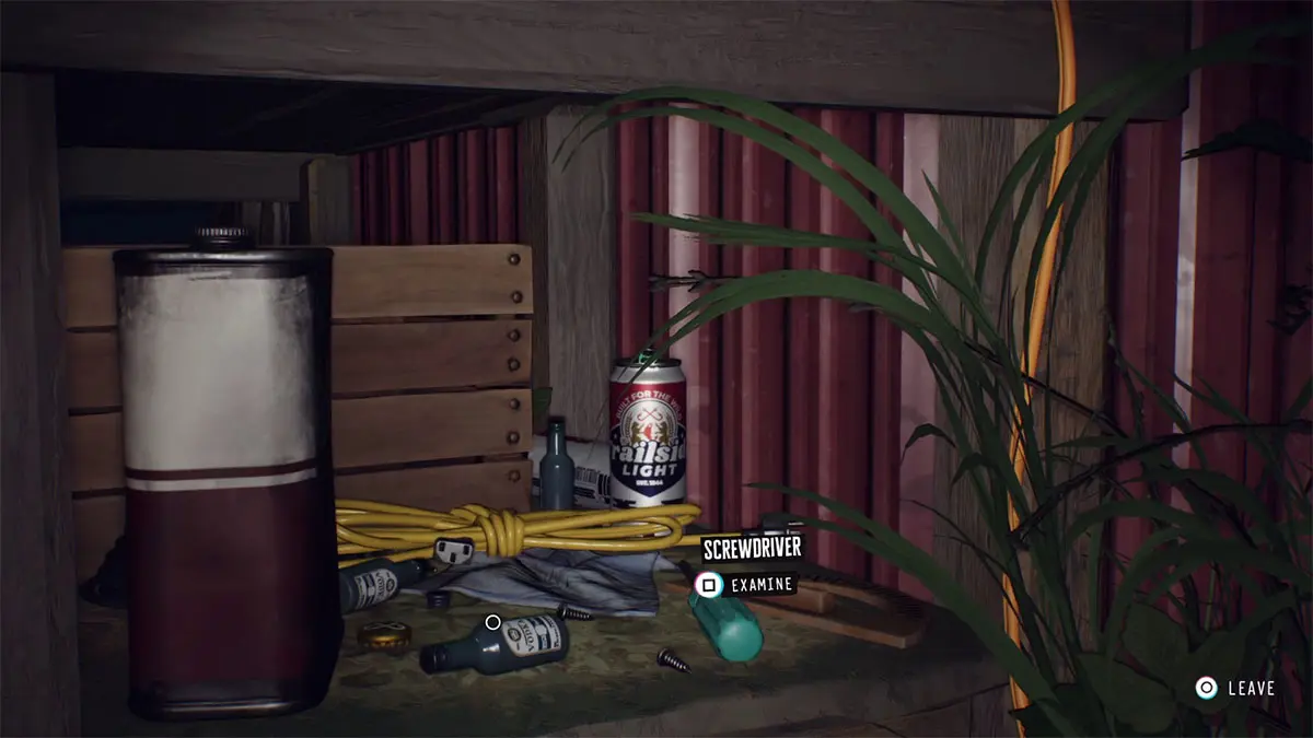 Look through the window on the right to find oil behind a box with tools.