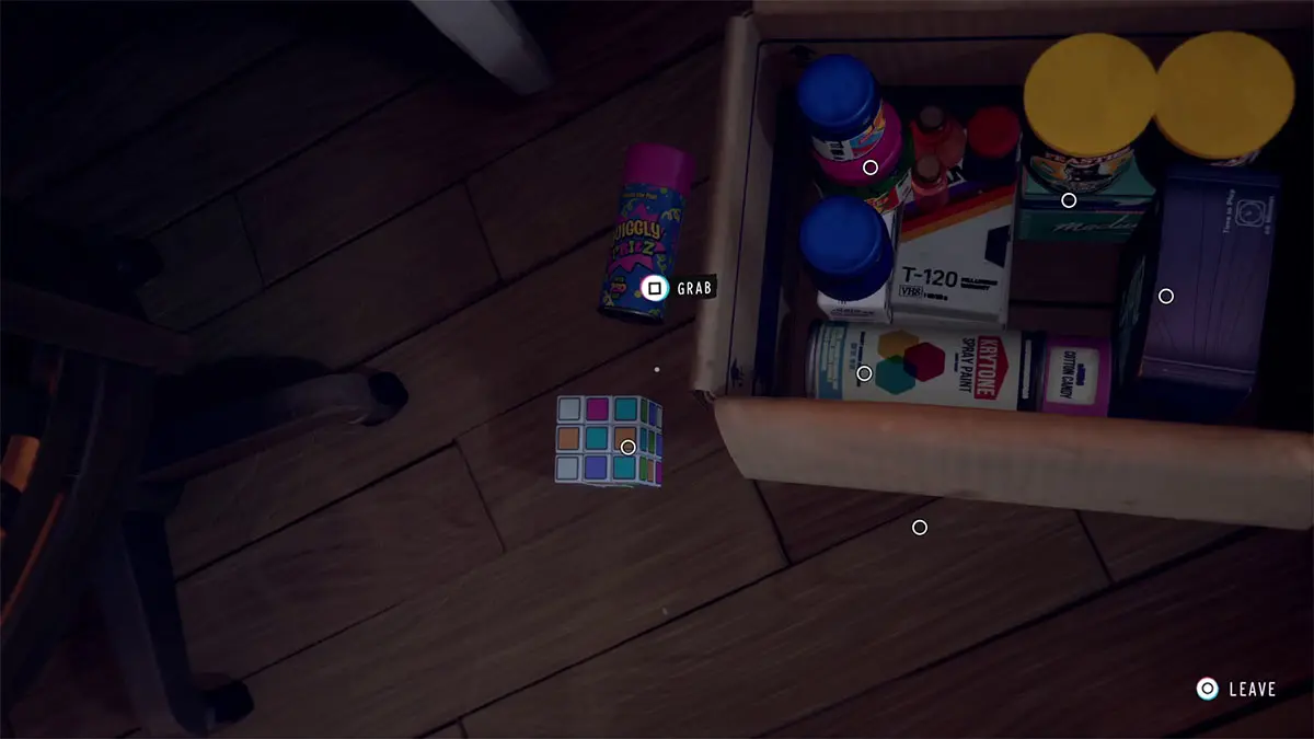 Place the spray paint on the lower left corner and the Rubik's cube on the empty spot.