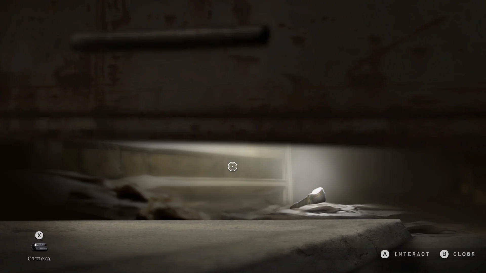 The flashlight seen under the door