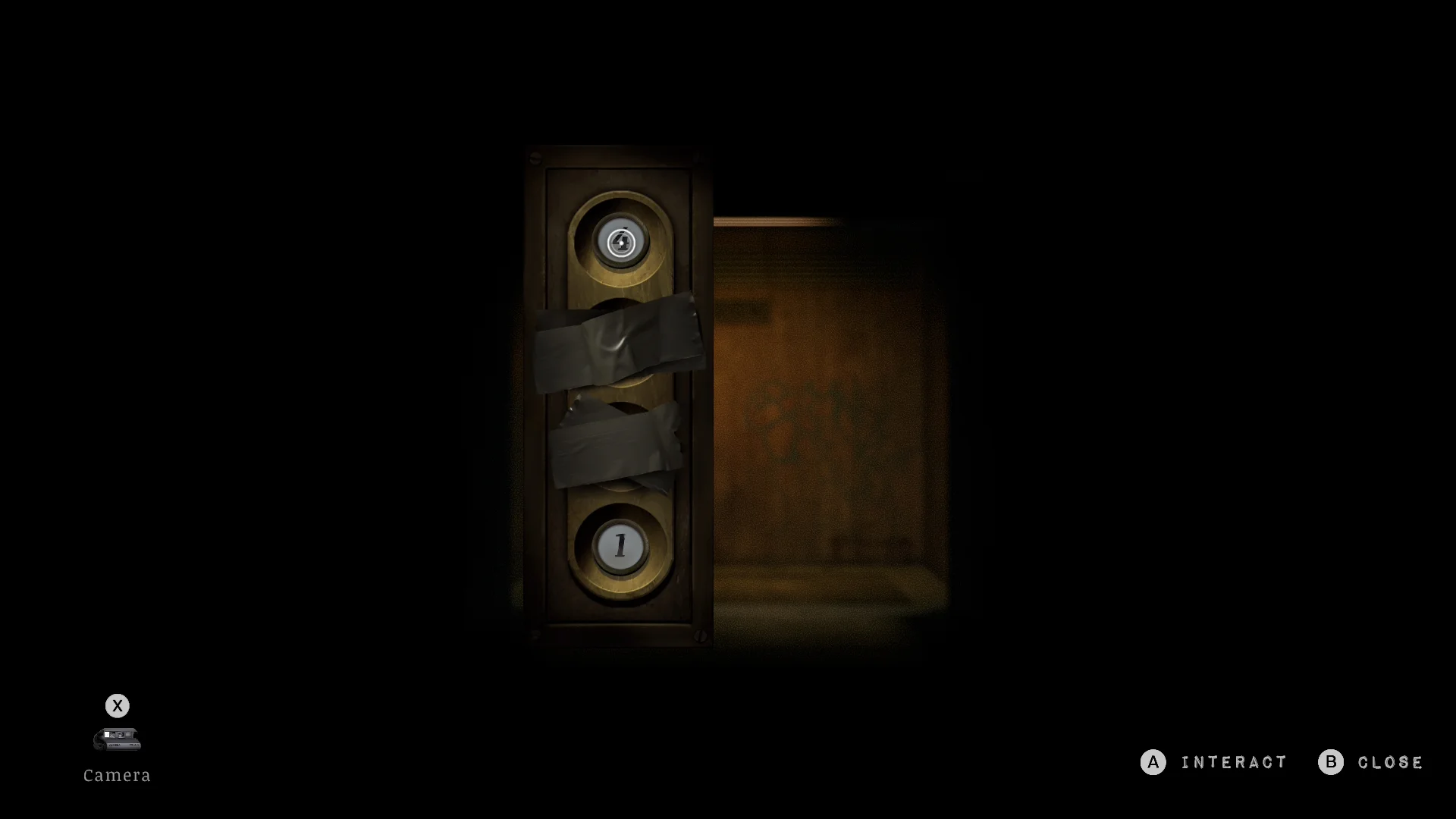 The elevator panel's missing button